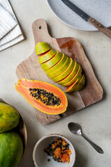 Papaya fruit closeup, sliced fresh papaya fruit with seeds