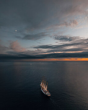 Aerial view of tranquil bay with luxury yachts sailing in the sunset, Primorje-Gorski Kotar, Croatia.