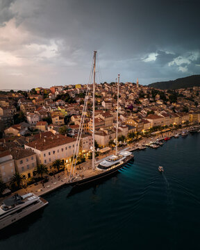 Aerial view of a beautiful coastal town with luxury yachts and sailboats in the harbor, Mali Losinj, Primorje-Gorski Kotar, Croatia.