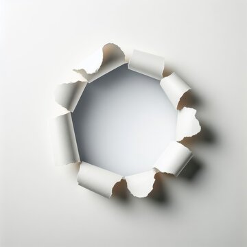 paper hole with torn edge on a white background 
