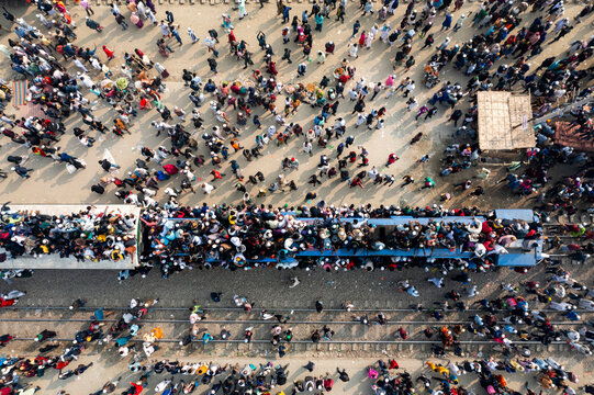 Aerial view of crowded train station with people celebrating festival, Dhaka Division, Bangladesh.
