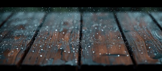 A wooden balcony that is wet with small hailstones. with copy space image. Place for adding text or design