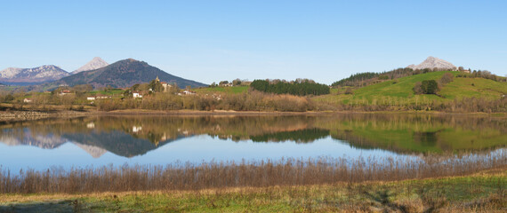 Urkulu urtegia. Urkulu Reservoir, Larrino Church and Mount Anboto in the background, Euskadi