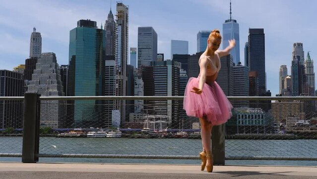 Ballerina dancer outdoors in front of Downtown Manhattan skyline