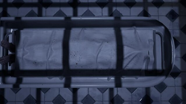 Two doctors standing in fron of a corpse in the morgue and ready to execute an autopsy