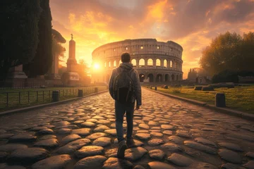 Rolgordijnen Man Walking Towards the Colosseum at Sunrise in Rome, Italy © bomoge.pl