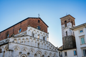 Intricately decorated facade and portal of the church of Santa Maria Forisportam, in Lucca,