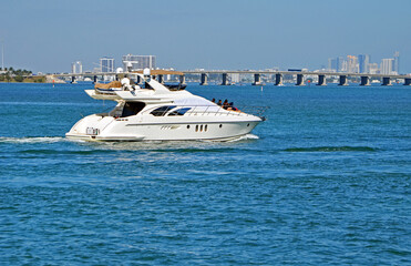 Luxury day charter motor yacht cruising the Florida Intracoastal Waterway off of Miami Beach.