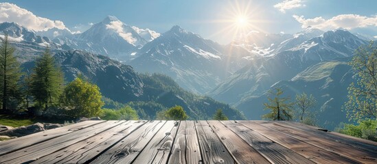 A wooden deck with views of majestic mountains in the background under a clear sky.