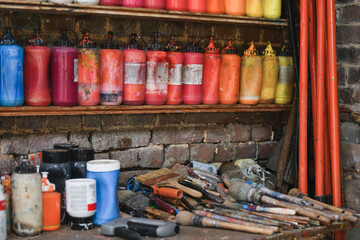 Jars with acrylic paints at a workshop