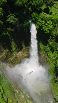 Waterfall of Lake Sebu. Beautiful cascades in the forest. Mindanao, Philippines. Vertical view.