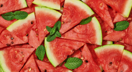 heap of fresh sliced watermelon with strawberries