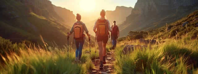 Foto op Canvas Mountain travel hike people adventure man summer journey tourism group sunset trekking. Hike travel woman mountain walk active backpack nature together sport young trail outdoor tourist hiker person © Максим Зайков
