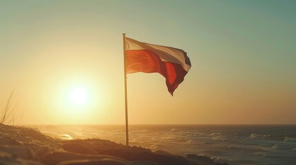 Polish flag fluttering at dusk with ocean backdrop and setting sun. Patriotic symbol of a country's flag against a golden hour seascape.