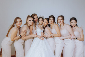 Portrait of the bride with her friends. Elegant and stylish bride with her friends in matching...