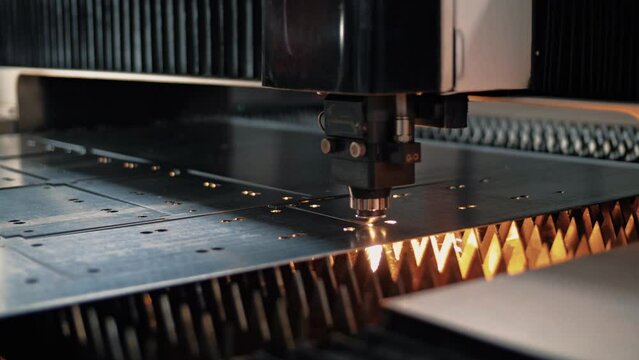 Automated operation of a plasma cutter of thin sheet metal on a CNC laser machine. Close-up 