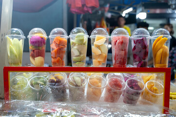 Colorful fruit cups at a market in Malaysia