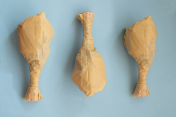 Plastic bags shaped like food items on blue background