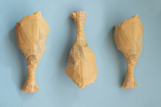 Plastic bags shaped like food items on blue background
