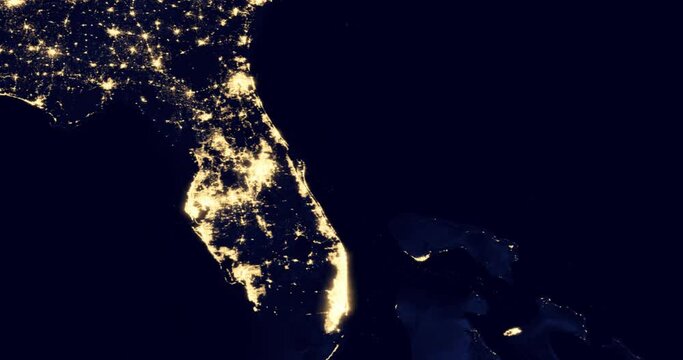 Flying over the bright lights of the glowing night cities of Florida, night view of US cities from an orbiting satellite. Elements of this image courtesy of NASA.