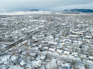 winter morning over city of Fort Collins and Front Range of Rocky Mountains in northern Colorado, aerial view