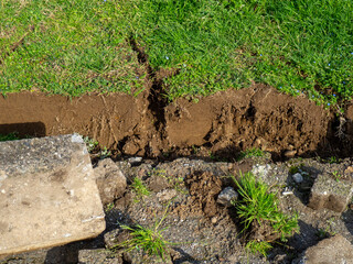 Repair work in the park. Uprooted curbs. Road repair.