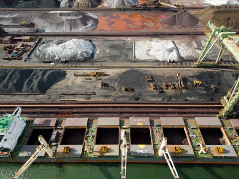 A large bulk carrier supplying iron-ore in a harbor