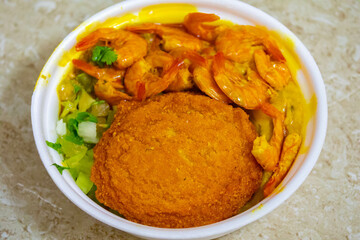 Brazilian acarajé traditional food of African origin in Bahia with vatapá caruru and dried shrimp