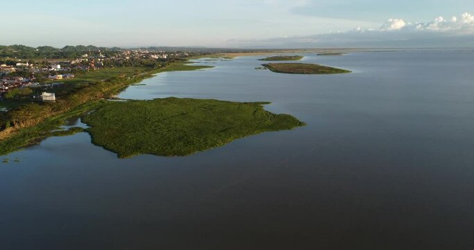 Lake in the morning. Aerial view. View from above on the outskirts of Sengkang City, South Sulawesi, Indonesia. Villages and lakes