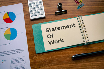 There is notebook with the word Statement Of Work. It is as an eye-catching image.