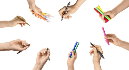 Set of hands holding pens and markers on white background