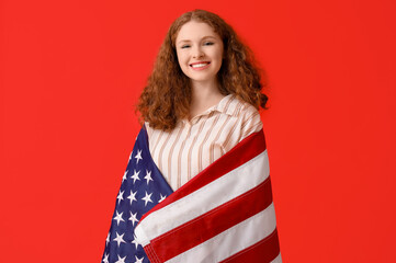 Young woman with USA flag on red background