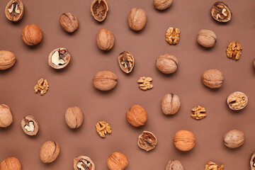 Natural walnuts on brown background