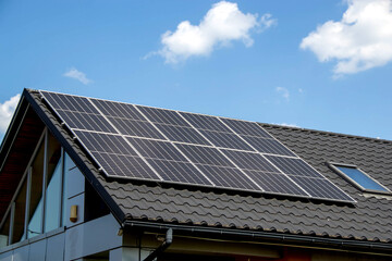 Fototapeta premium House roof with photovoltaic modules.