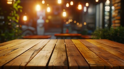 Empty wooden table with bokeh light effect and blur restaurant background for your photo montage or...