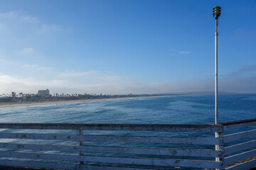 Early morning at Pacific Beach surrounded by seaside hotels and recreational areas as seen from Crystall Pier in San Diego, Southern California