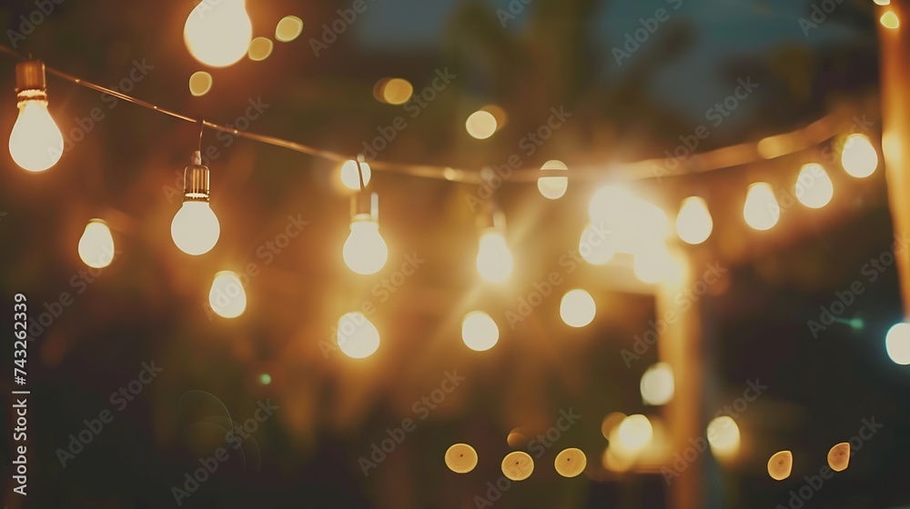 Poster vintage tone abstract blur image of outdoor party in night time with light bokeh for background usag