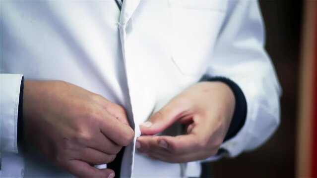 Student Buttoning Up His Elementary Uniform in the Morning in Buenos Aires, Argentina. Close Up. 4K Resolution.