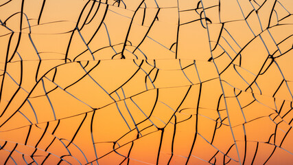 Sunset gradient through cracked glass
