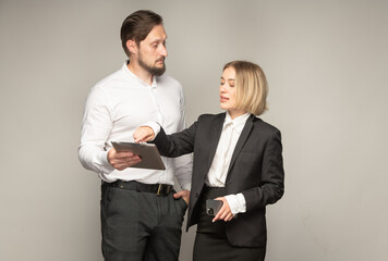 business couple with a tablet discussing something isolated - 743294751