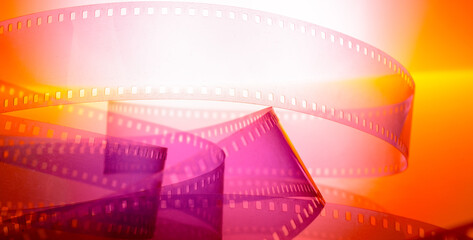 multicolored cinematic background with film strip - 743295122
