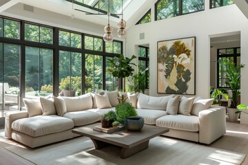 A modern, well-lit living room with large windows, comfortable furniture, and an abundance of greenery.