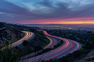 A long exposure shot of a highway at night, capturing the light trails of moving vehicles under a twilight sky.