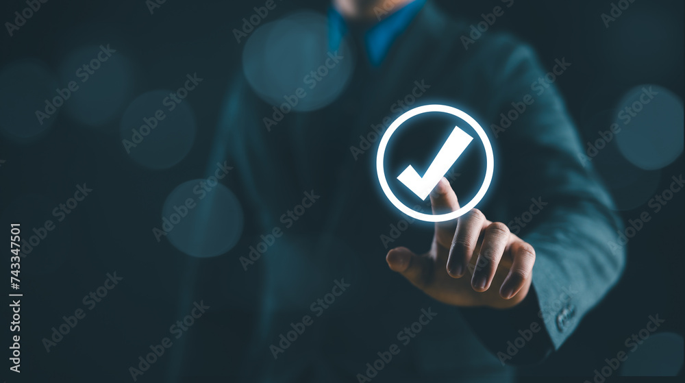 Poster businessman hand touching glowing correct sign mark with copy space area for document approval and p