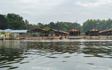 Obraz premium Inle Lake City, The Floating village urban city town houses, lake sea or river. Nature landscape fisheries and fishing tools, Myanmar. Aquaculture farming