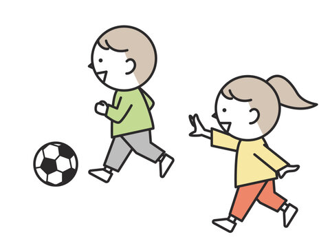 楽しそうにサッカーをする子供たち