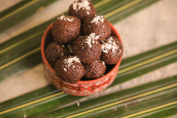 coconut balls, chocolate balls closeup with selective focus and blur