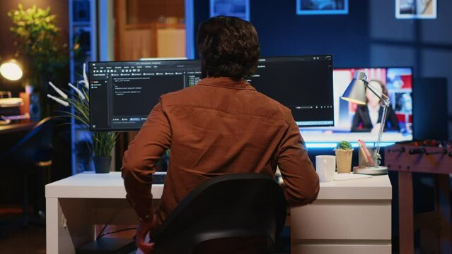 Engineer arriving in home office with mug of coffee in hand, ready to start coding using javascript. IT expert beginning remote work shift, holding cup of tea, updating company software, camera A