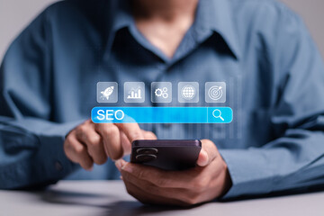 SEO concept, Promoting ranking traffic on website and optimizing your website to rank in search engines. Businessman using smartphone with search bar to analyze SEO search engine optimization.
