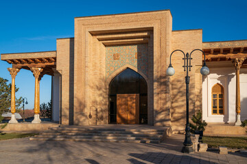 Fototapeta na wymiar View of the administrative building on the territory of the Bahauddin Naqshbandi Memorial Complex and Museum on a sunny day, Bukhara, Uzbekistan